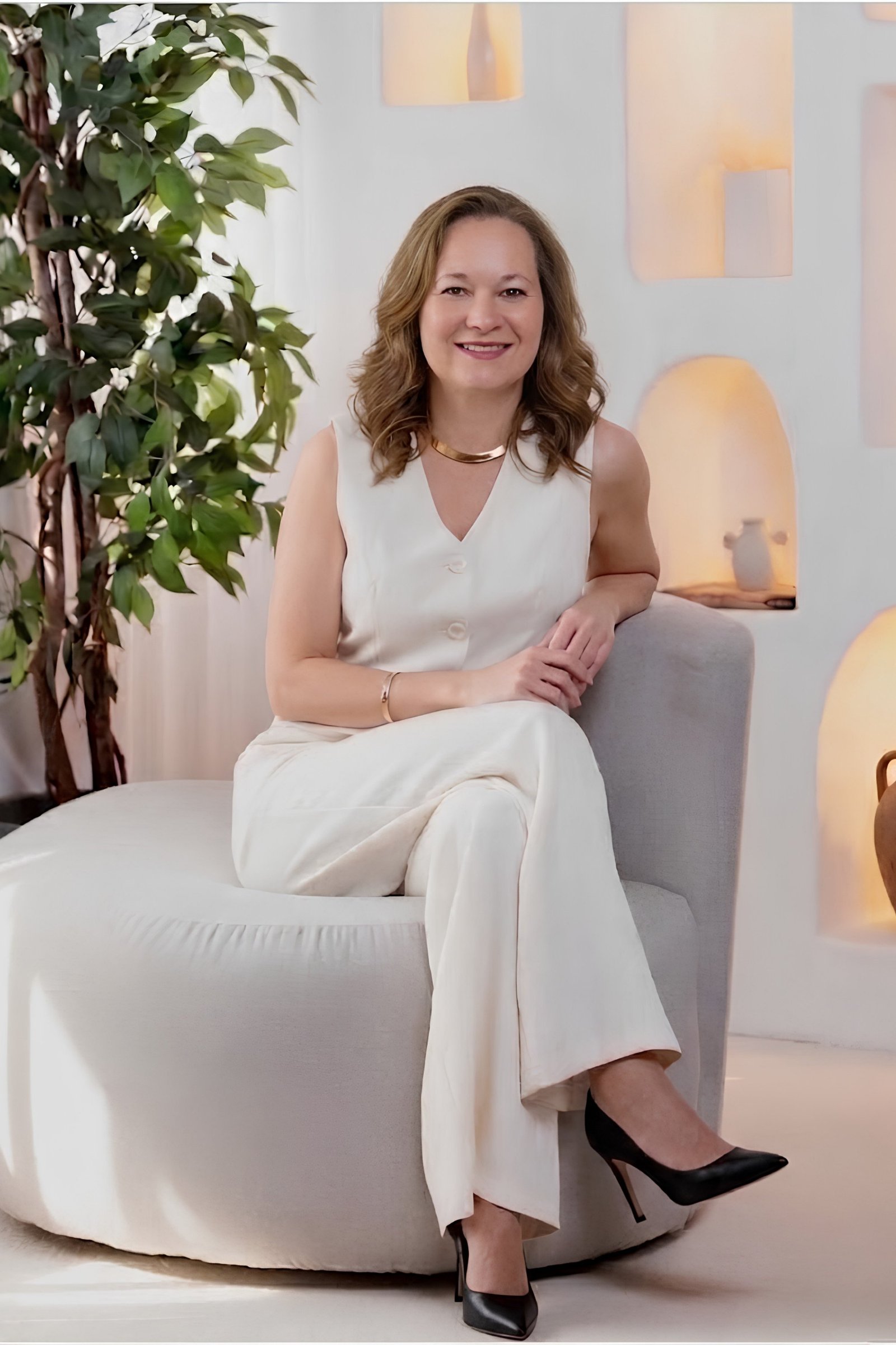 Nina seated in an armchair