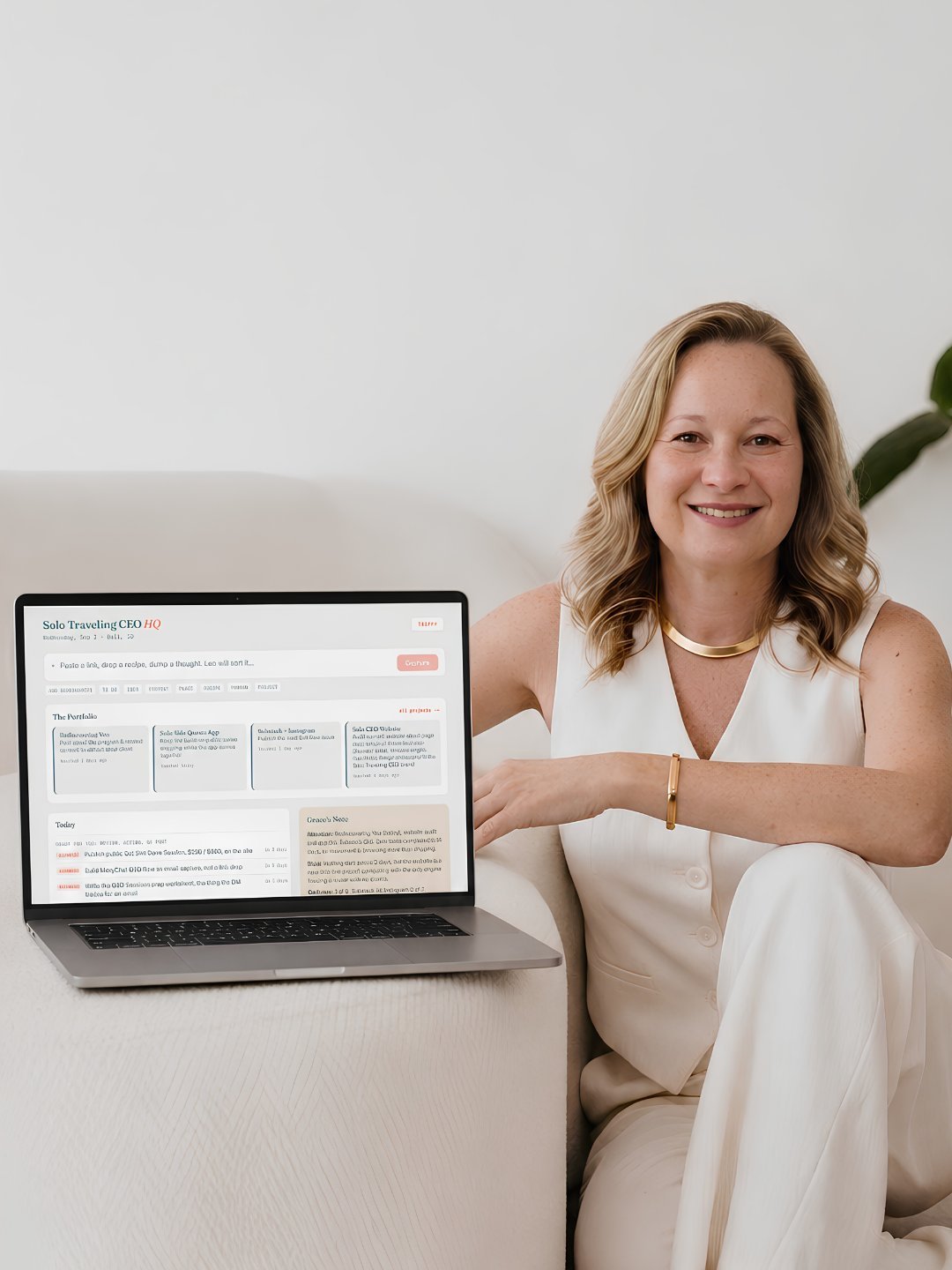 Nina seated beside a laptop showing her Business HQ dashboard